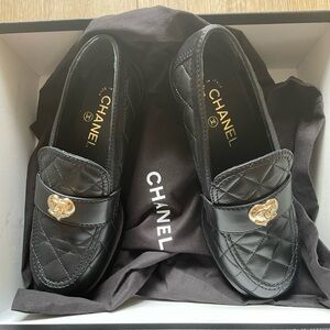 CHANEL Black Quilted Loafers with Gold Detail